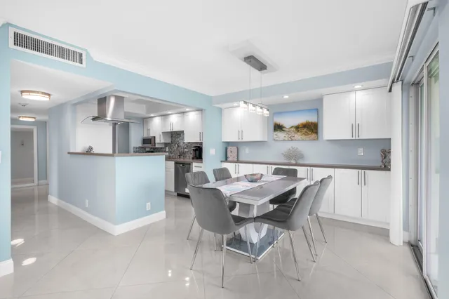 a kitchen with a table and chairs in it
