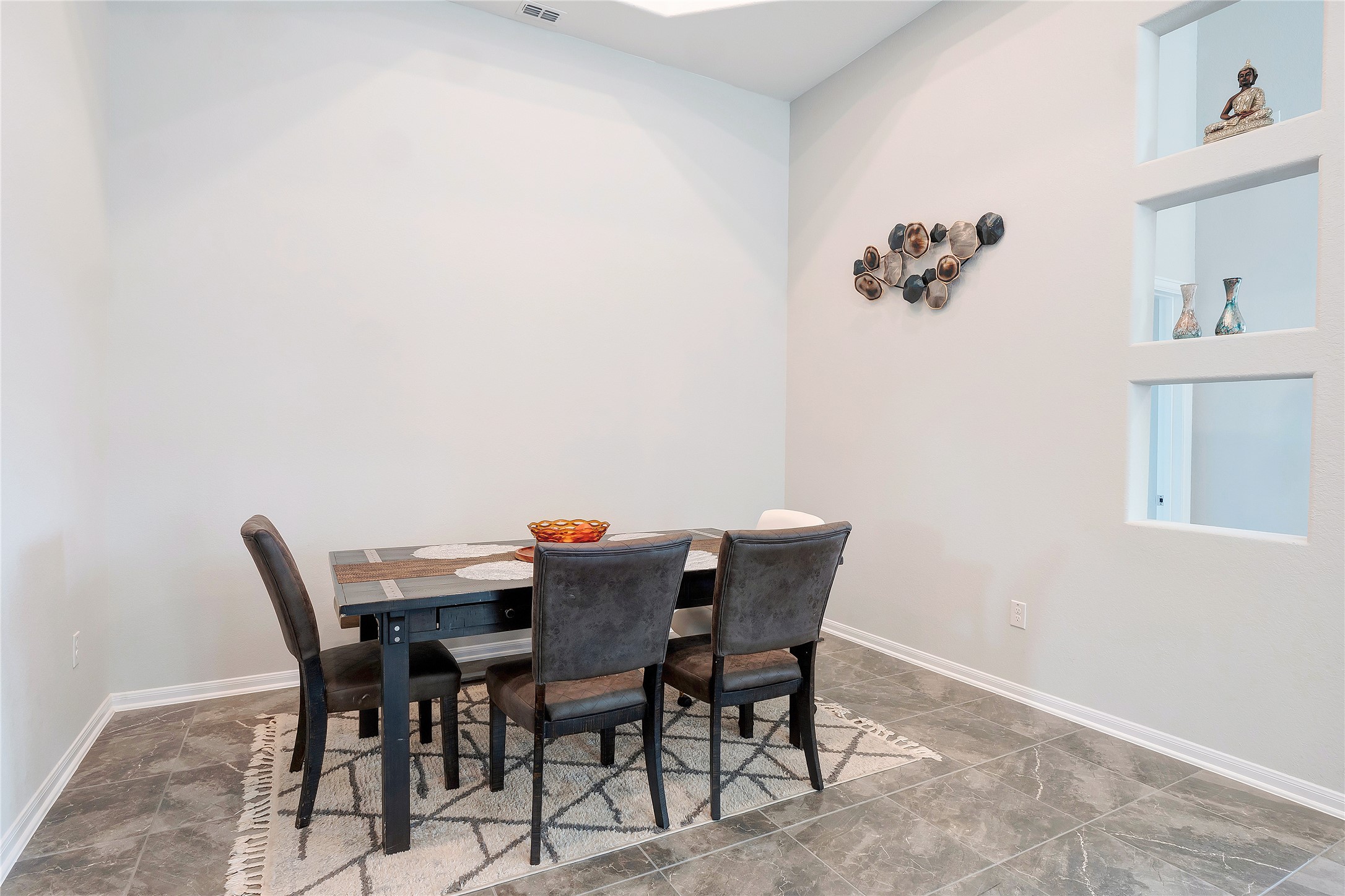 574 Sugar Cane Buda, TX 78610 - Photo 10 of 35 a view of a dining room with furniture and wooden floor