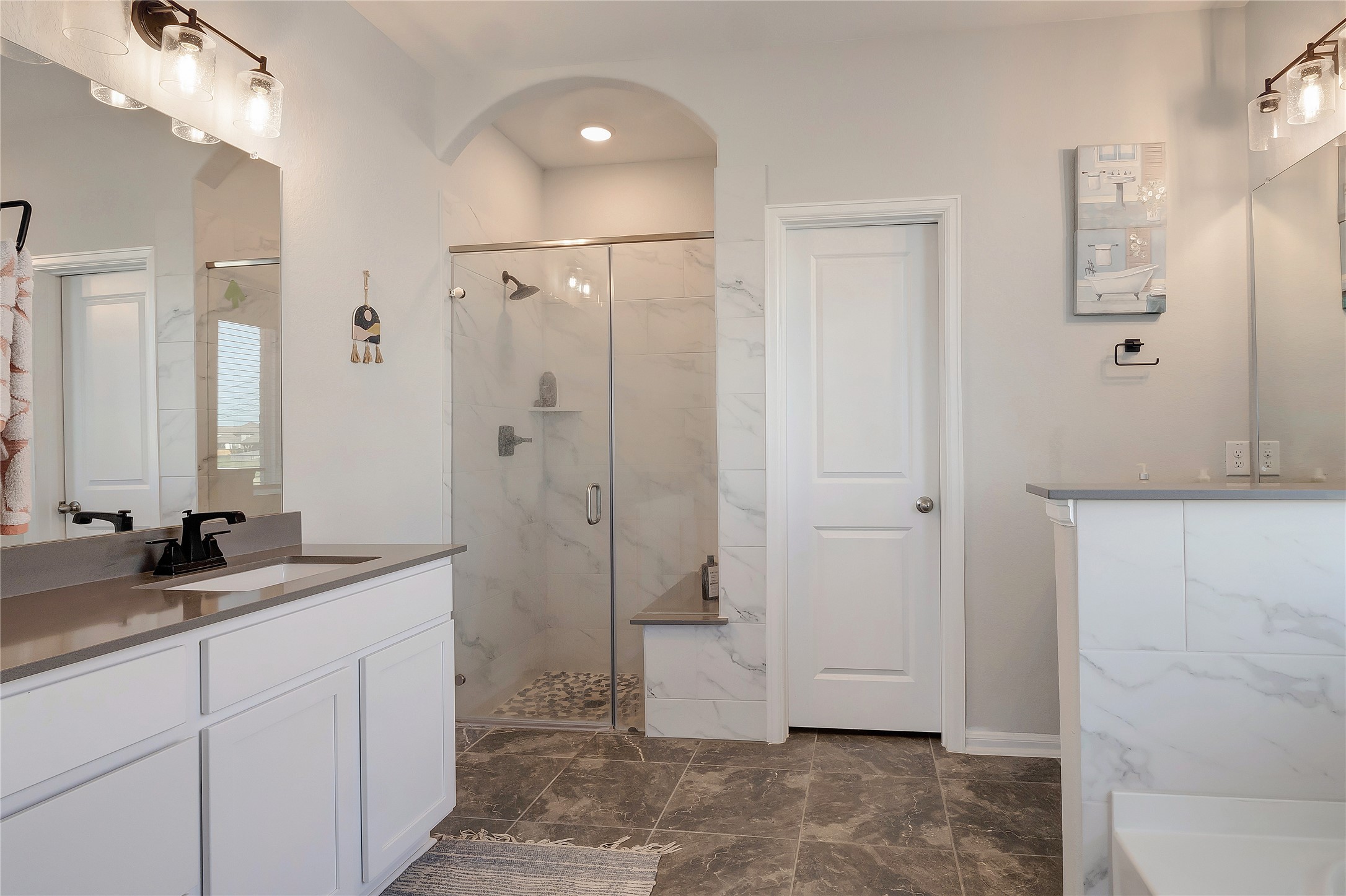 574 Sugar Cane Buda, TX 78610 - Photo 15 of 35 a spacious bathroom with a granite countertop sink a mirror and a shower
