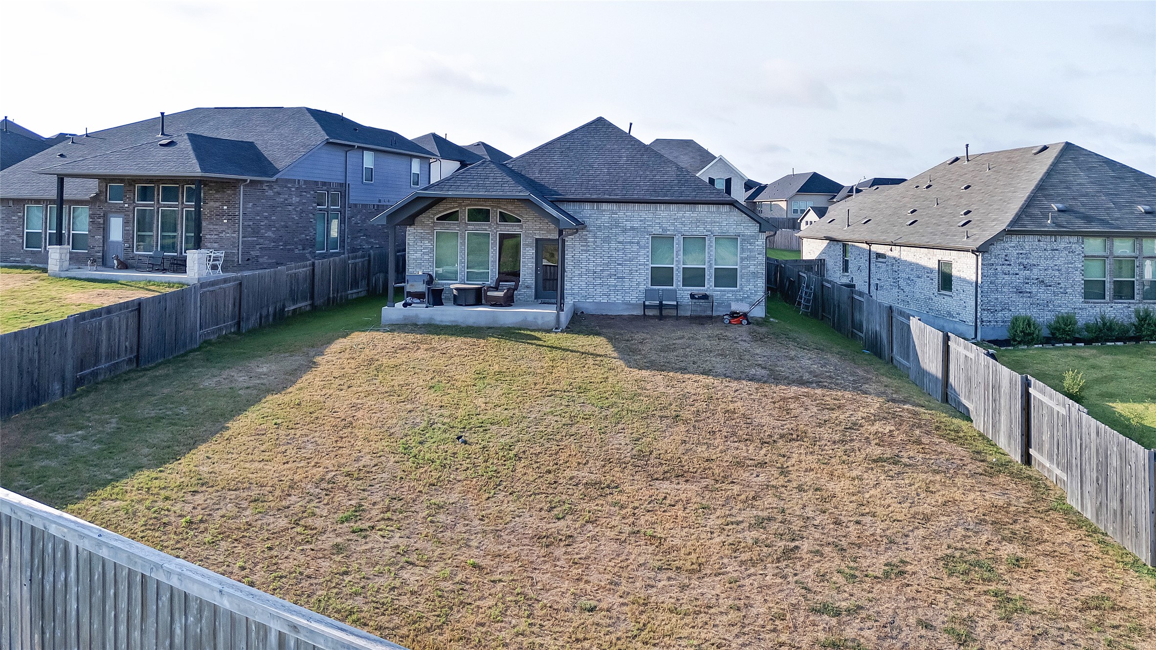 574 Sugar Cane Buda, TX 78610 - Photo 2 of 35 a front view of a house with garden