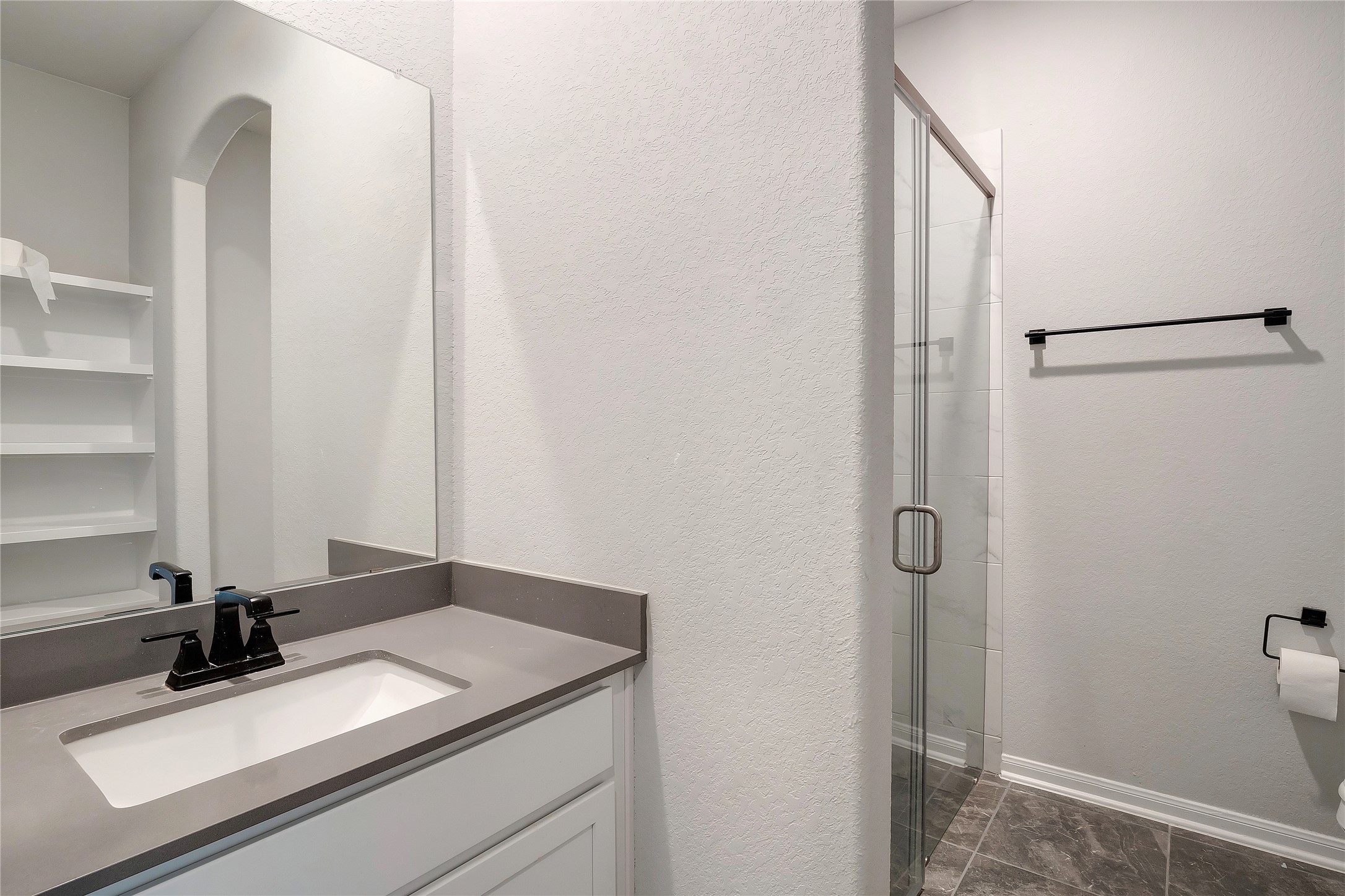 574 Sugar Cane Buda, TX 78610 - Photo 22 of 35 a bathroom with a sink and a mirror