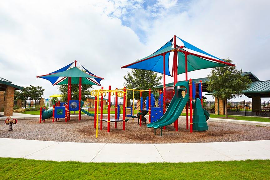 574 Sugar Cane Buda, TX 78610 - Photo 27 of 35 a view of a park with swings and slides