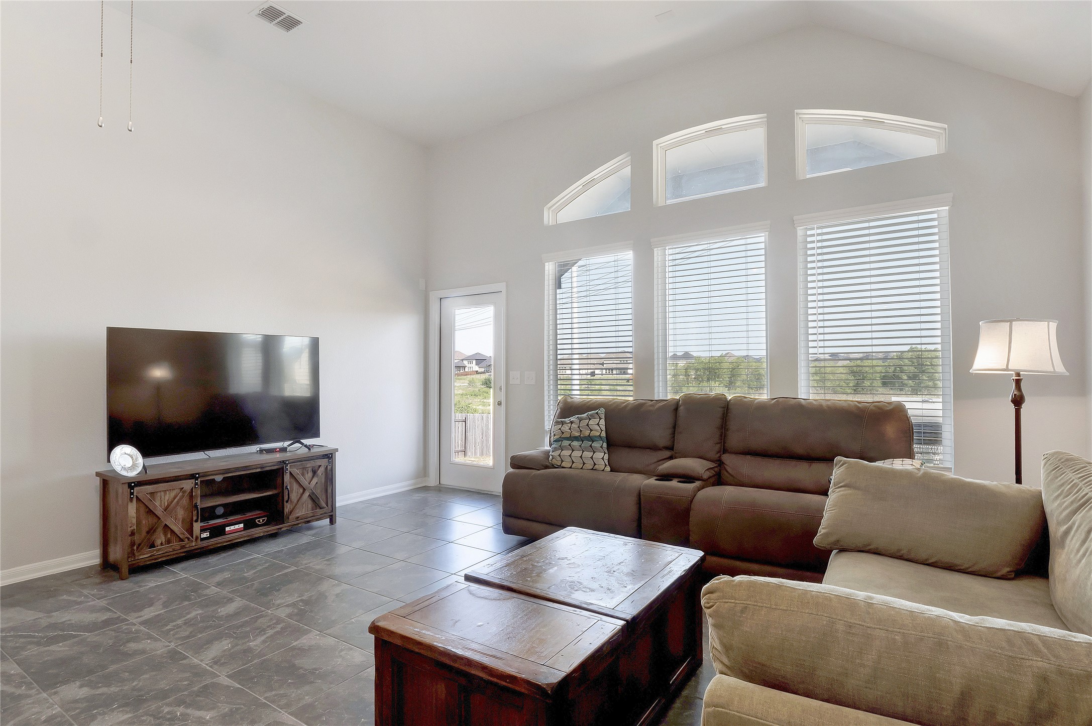 574 Sugar Cane Buda, TX 78610 - Photo 4 of 35 a living room with furniture and a flat screen tv