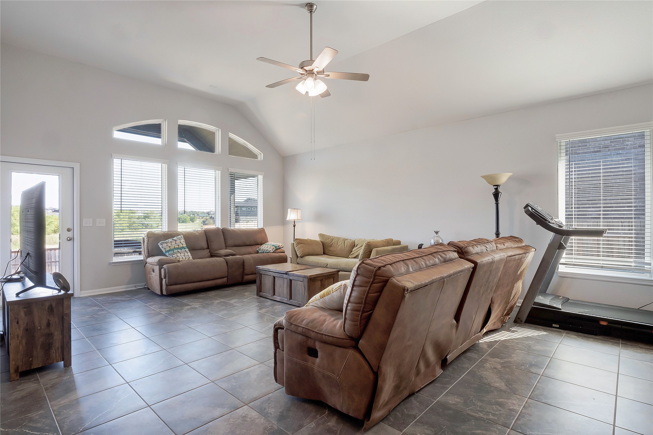 574 Sugar Cane Buda, TX 78610 - Photo 5 of 35 a living room with furniture and a chandelier