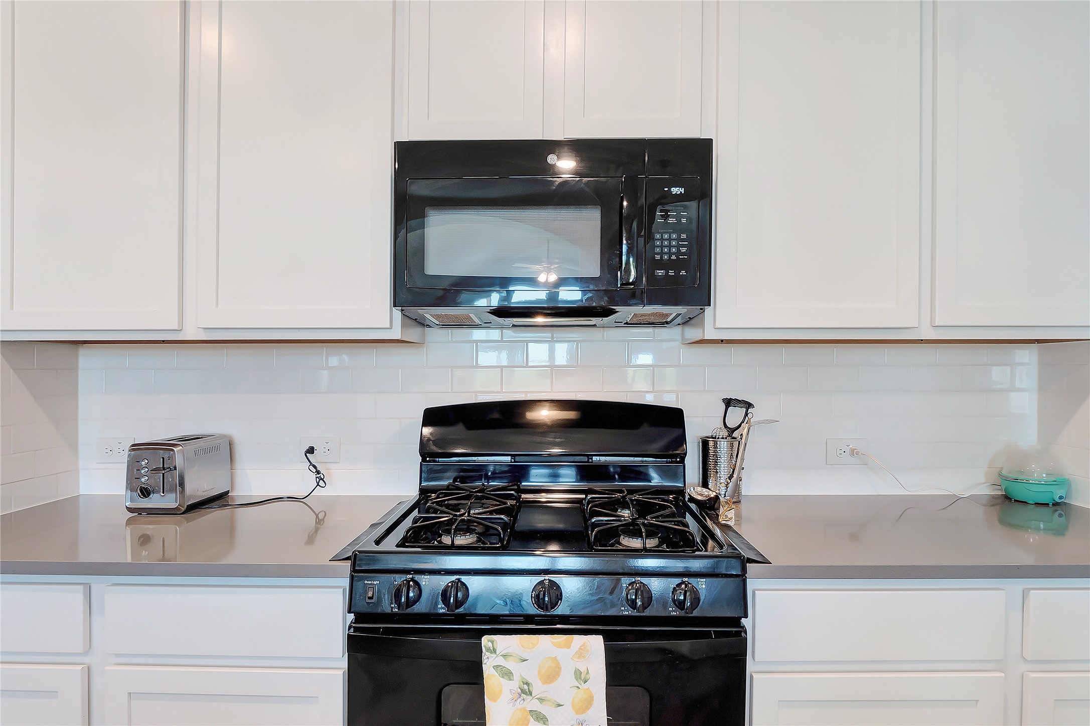 574 Sugar Cane Buda, TX 78610 - Photo 9 of 35 a stove top oven sitting inside of a kitchen and granite counter tops