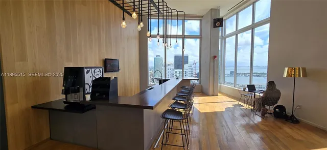 a room with gym equipment and a large window