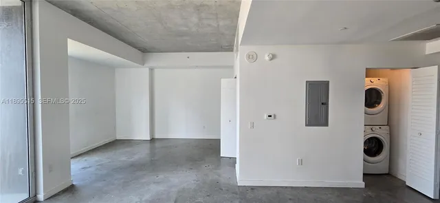 a view of a storage & utility room with a washer dryer