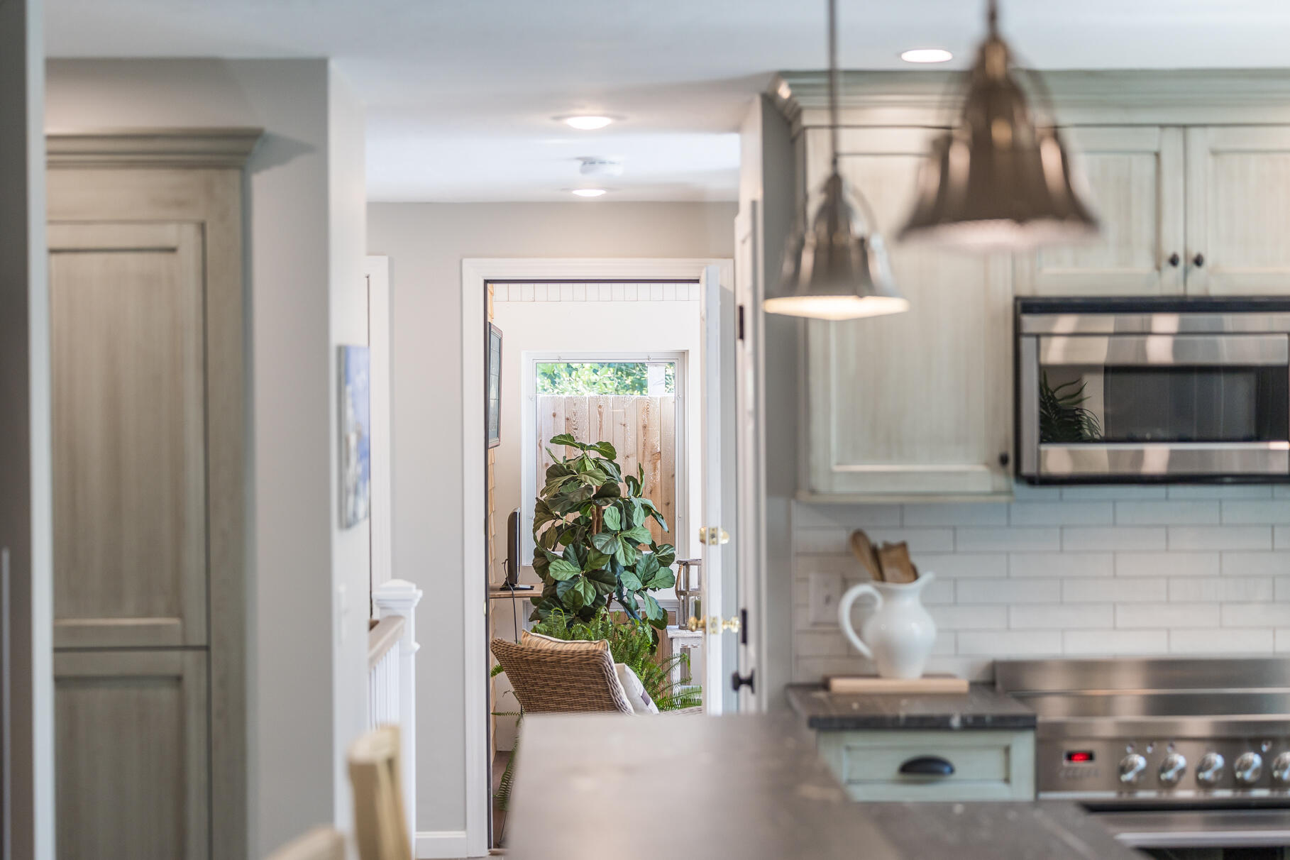 51 North Gate Road Chatham, MA 02633 - Photo 15 of 50 a kitchen with stainless steel appliances a stove a microwave and cabinets