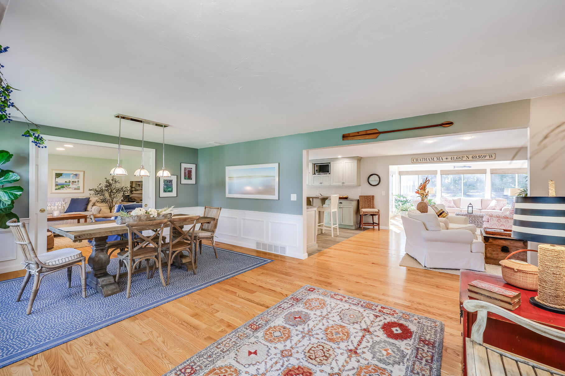 51 North Gate Road Chatham, MA 02633 - Photo 3 of 50 a living room with furniture a dining table and chairs with wooden floor