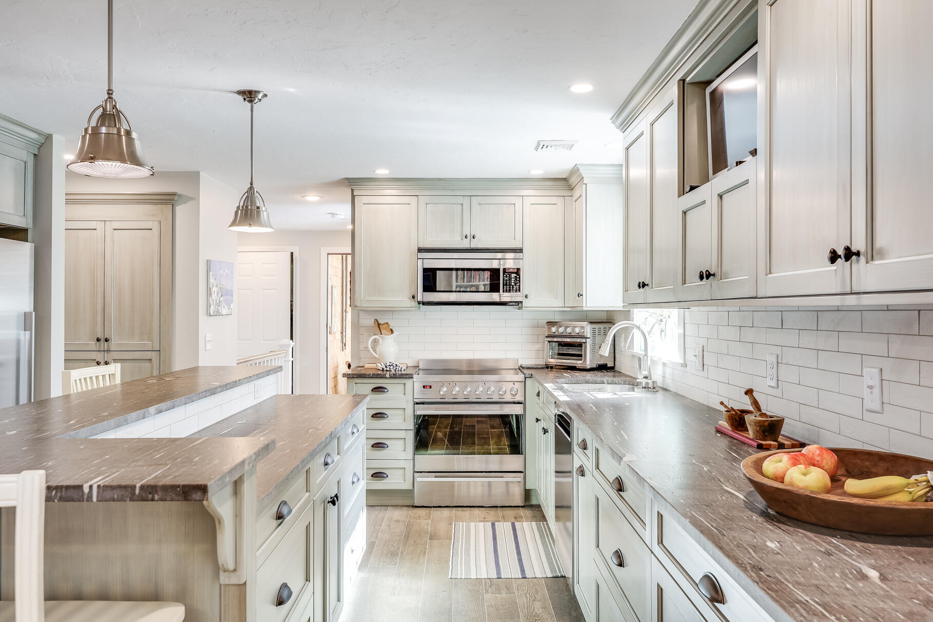 51 North Gate Road Chatham, MA 02633 - Photo 8 of 50 a kitchen with stainless steel appliances granite countertop a stove a sink and a refrigerator