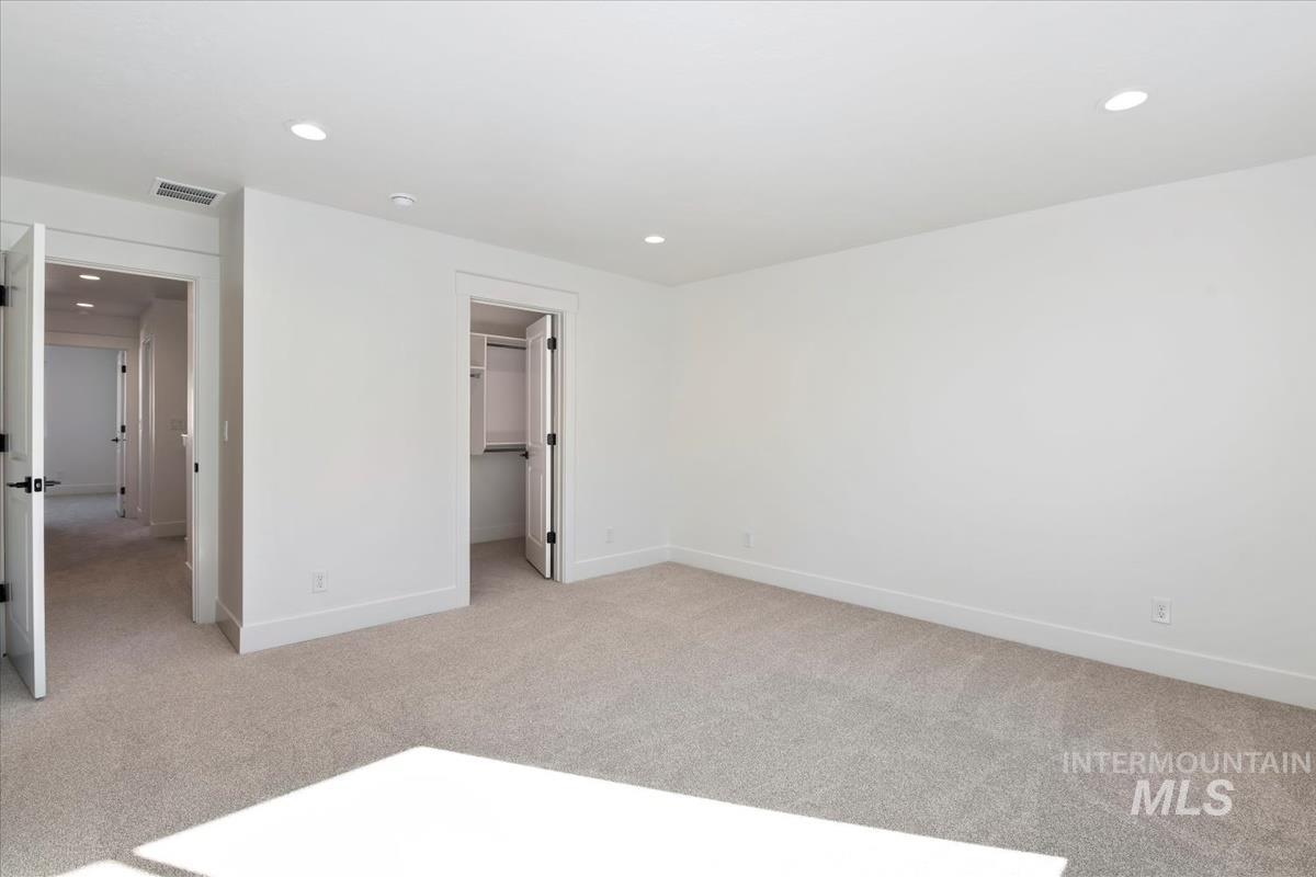 752 South Calhoun Lane Star, ID 83669 - Photo 28 of 45 Spacious room featuring neutral carpeting and white painted walls