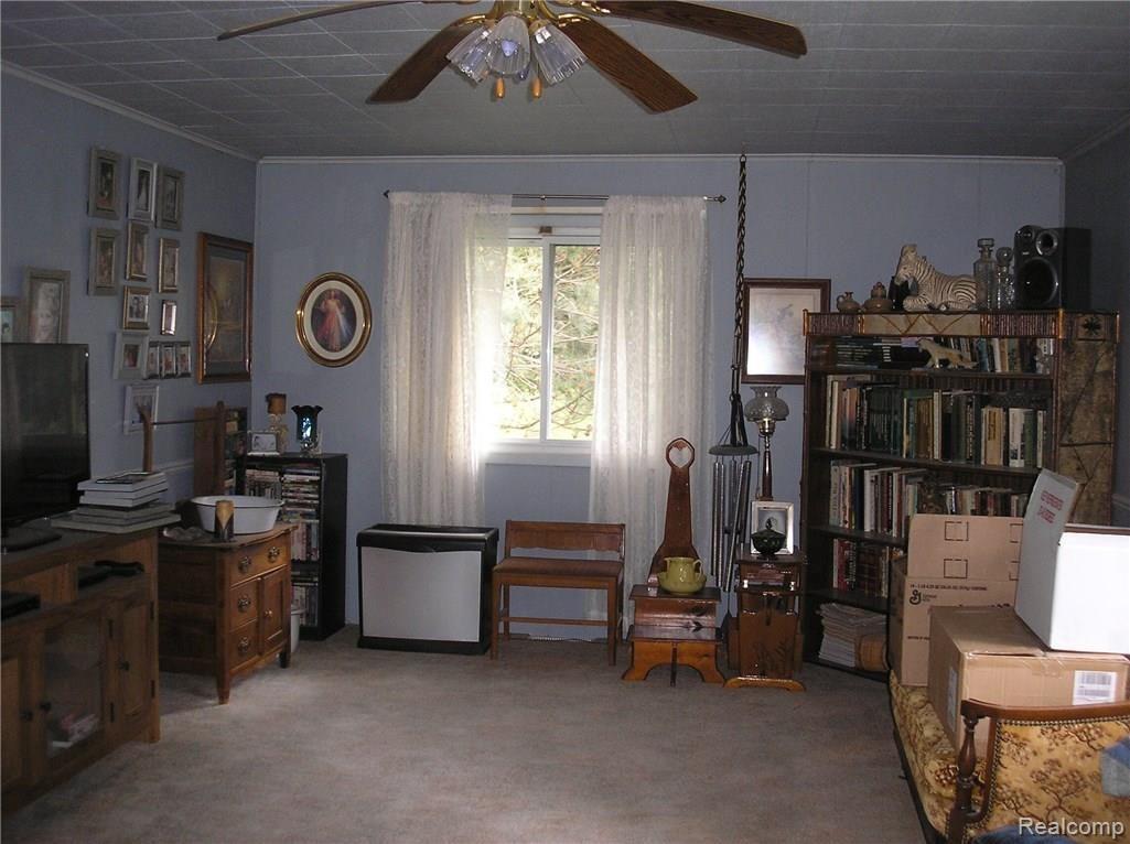 678 East Brown Road Mayville, MI 48744 - Photo 5 of 7 Family room with wood stove.