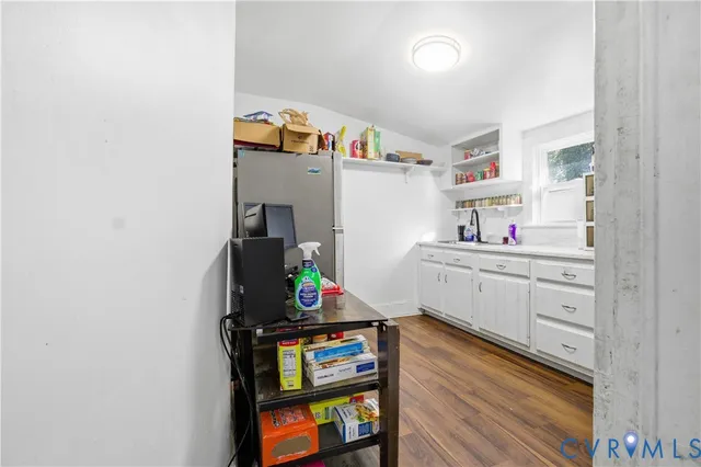 a kitchen with a stove and a sink