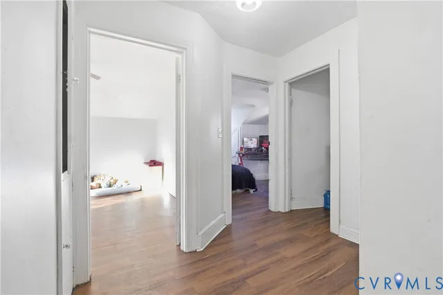 a bed sitting in a room next to a window