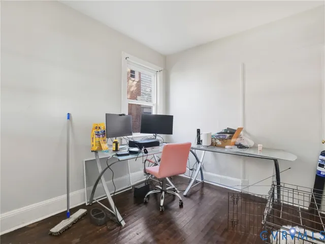 a workspace with furniture and wooden floor