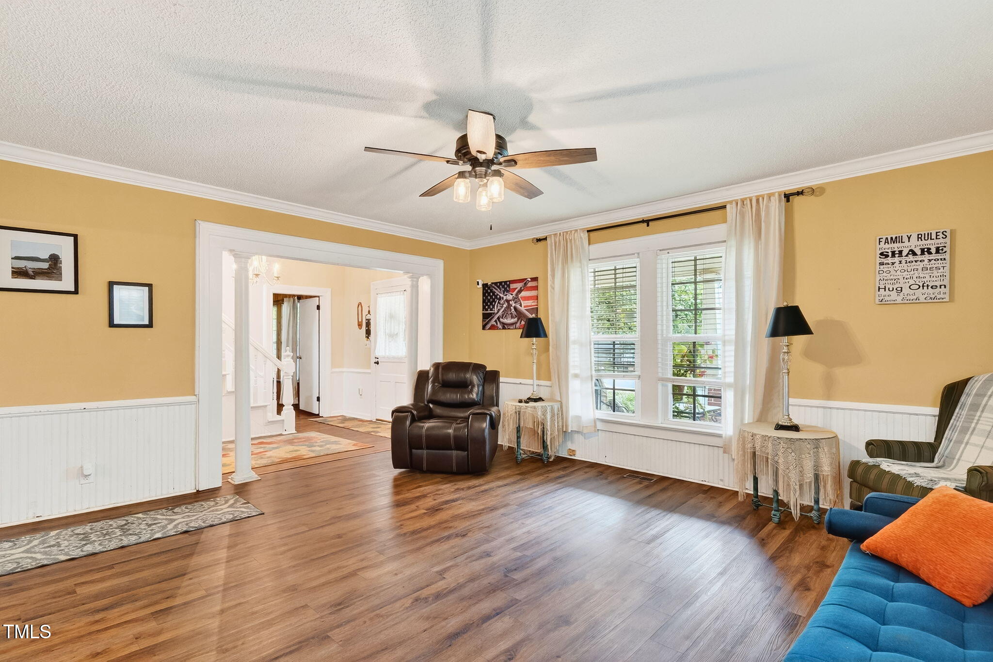 301 2nd Street Spring Hope, NC 27882 - Photo 11 of 49 a living room with furniture floor to ceiling window and wooden floor