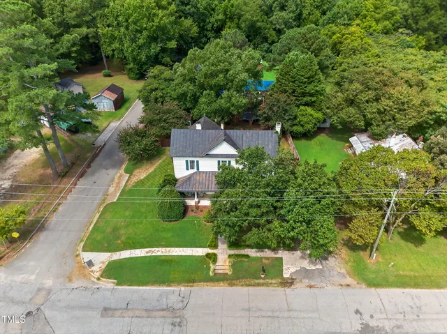 an aerial view of house with yard