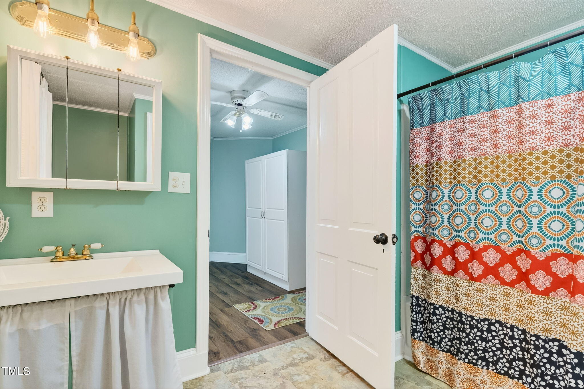 301 2nd Street Spring Hope, NC 27882 - Photo 30 of 49 a bathroom with a sink and a mirror