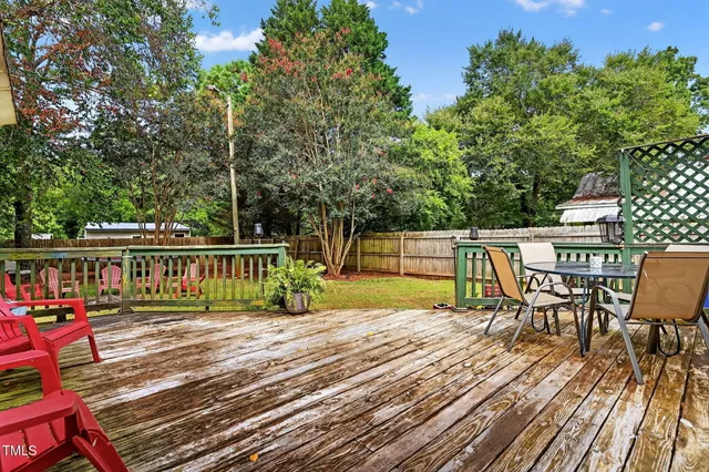 a view of a house with swimming pool and porch