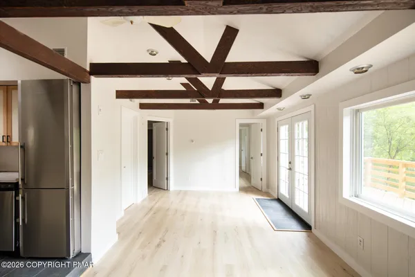 a view of a hallway with a chandelier