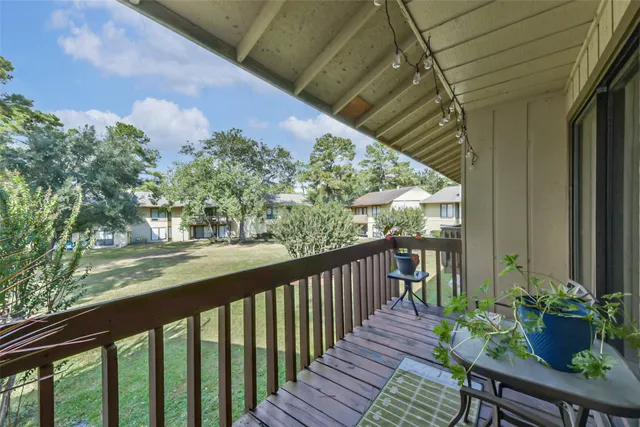 a view of a balcony with chairs