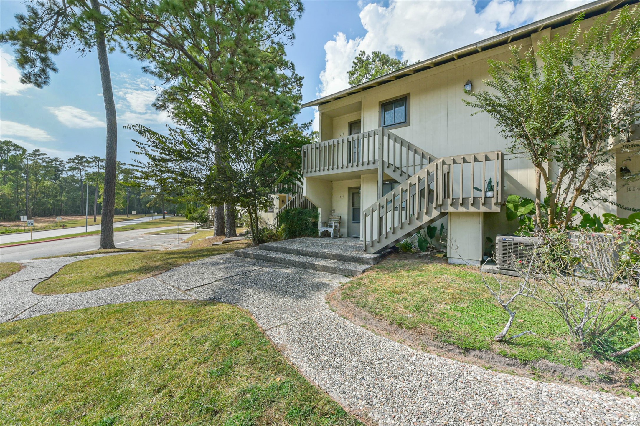 15919 Golf Club Drive, Unit 215 Crosby, TX 77532 - Photo 13 of 16 a view of a house with a yard