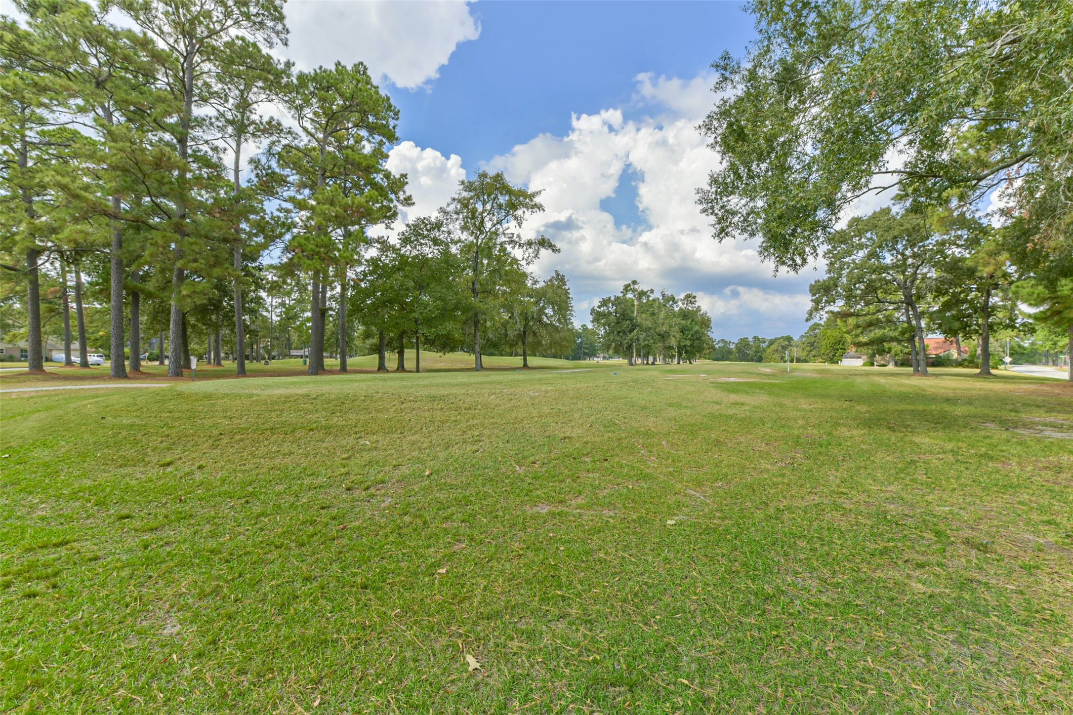 15919 Golf Club Drive, Unit 215 Crosby, TX 77532 - Photo 16 of 16 a building with trees in the background