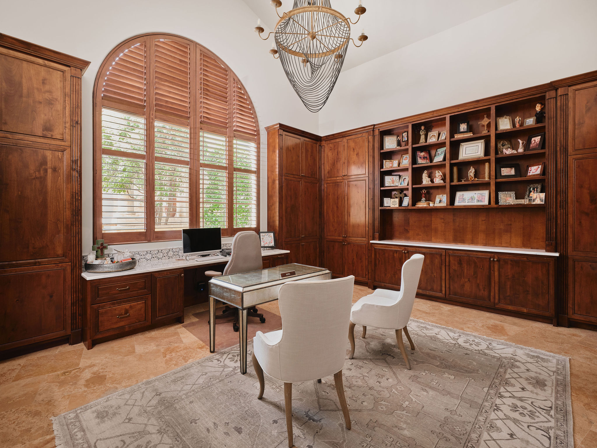 433 Brandon Way Austin, TX 78733 - Photo 21 of 40 Custom cabinetry and built-in shelving create a sophisticated and functional home office space.