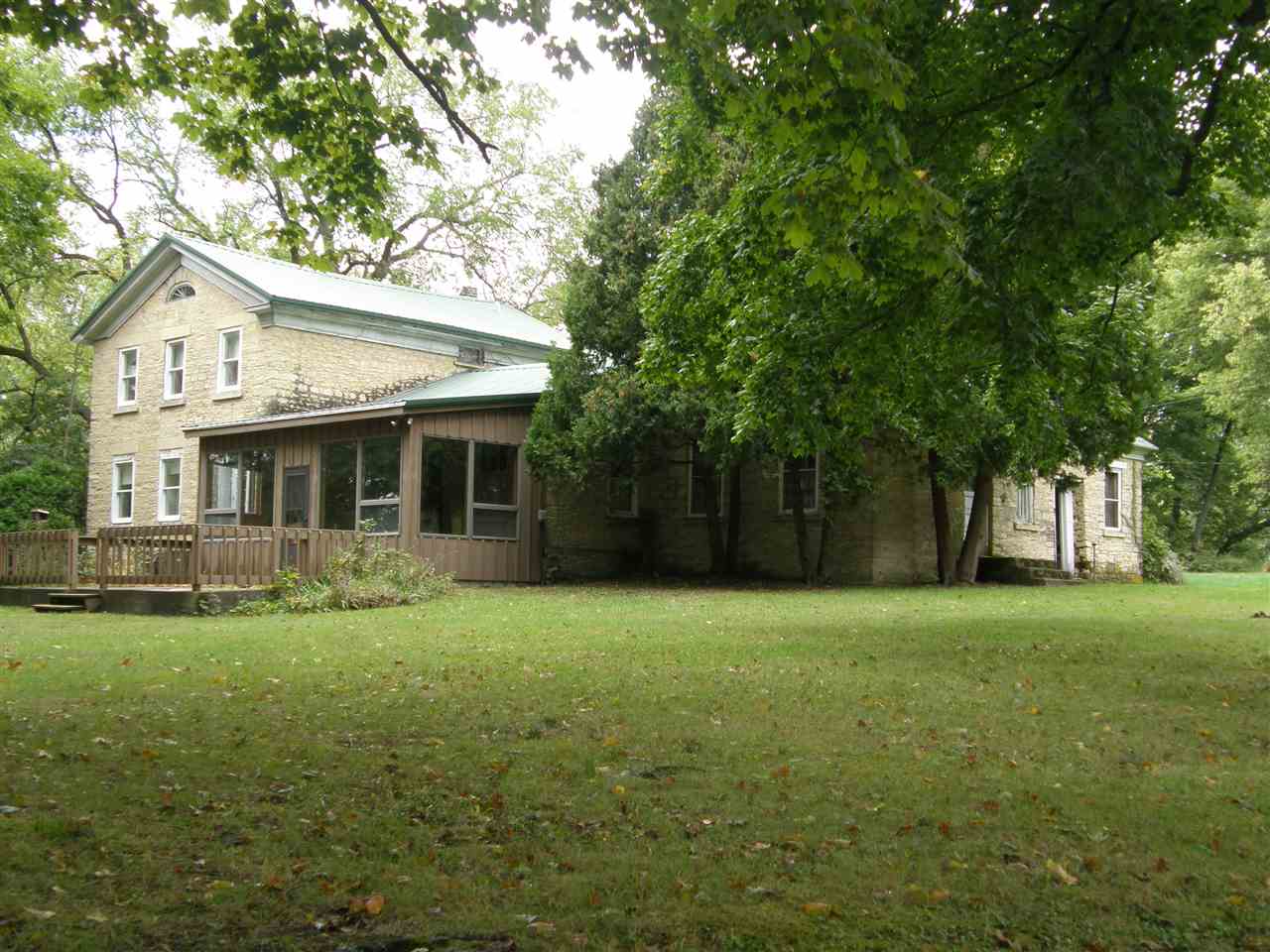 14435 West Campbell Road Durand, IL 61024 - Photo 1 of 3 a front view of a house with a garden