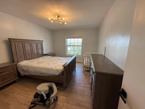 a bathroom with a shower and a sink