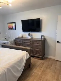 a bathroom with a sink vanity mirror and toilet