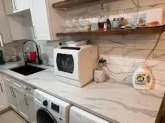 a kitchen with a stove and a sink