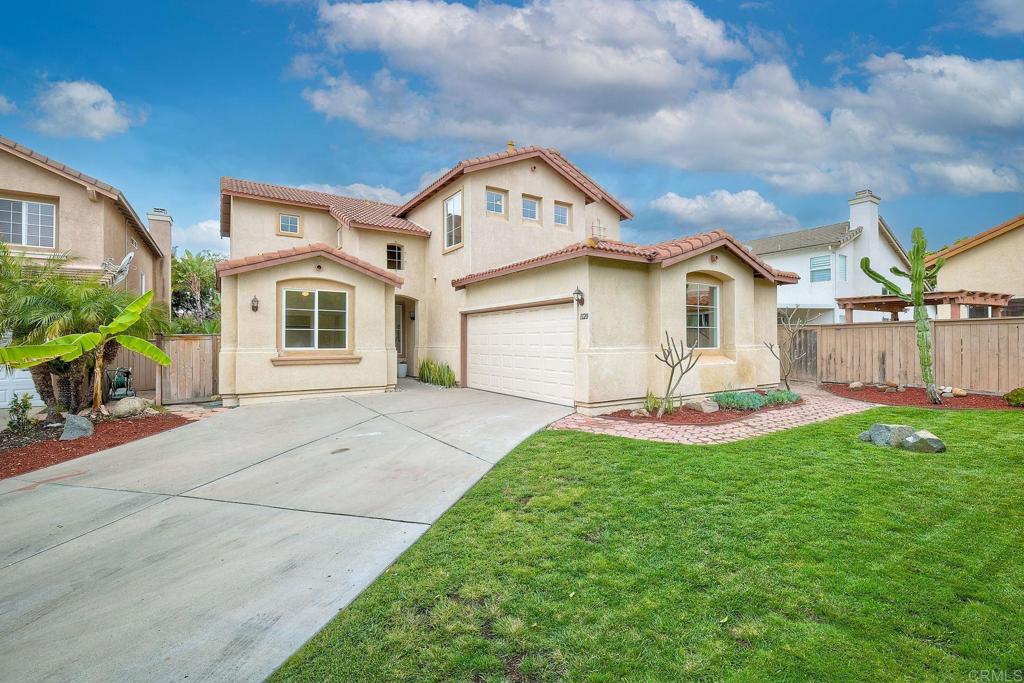a front view of a house with a yard and porch