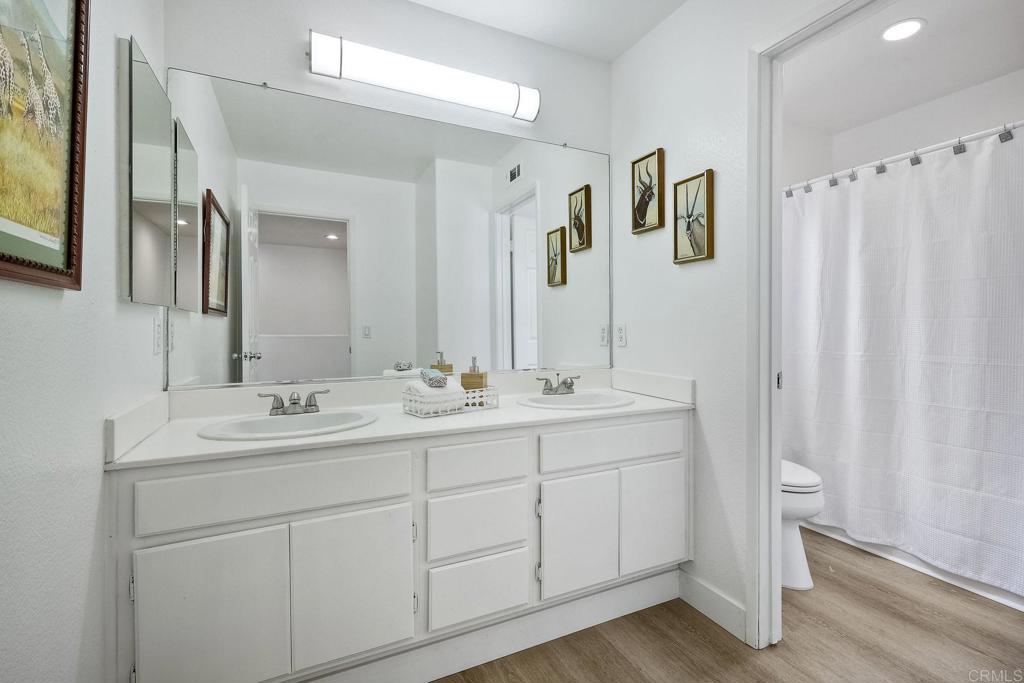 1120 Lassen Peak Place Chula Vista, CA 91913 - Photo 22 of 48 a bathroom with a double vanity sink and mirror