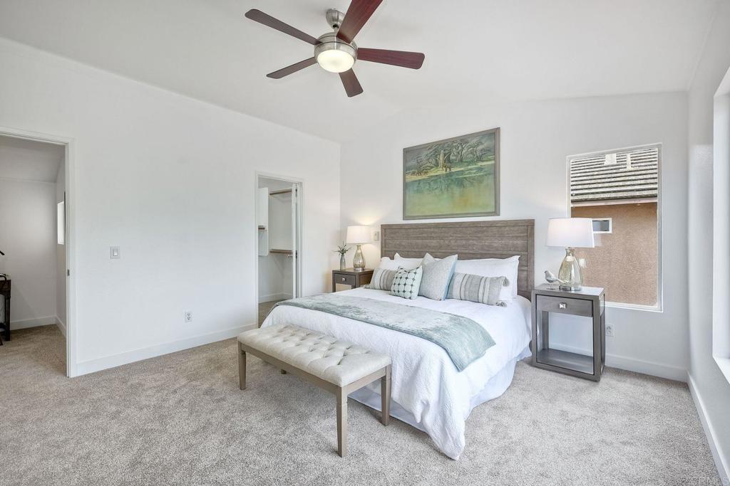 1120 Lassen Peak Place Chula Vista, CA 91913 - Photo 27 of 48 a bedroom with a bed and a chandelier