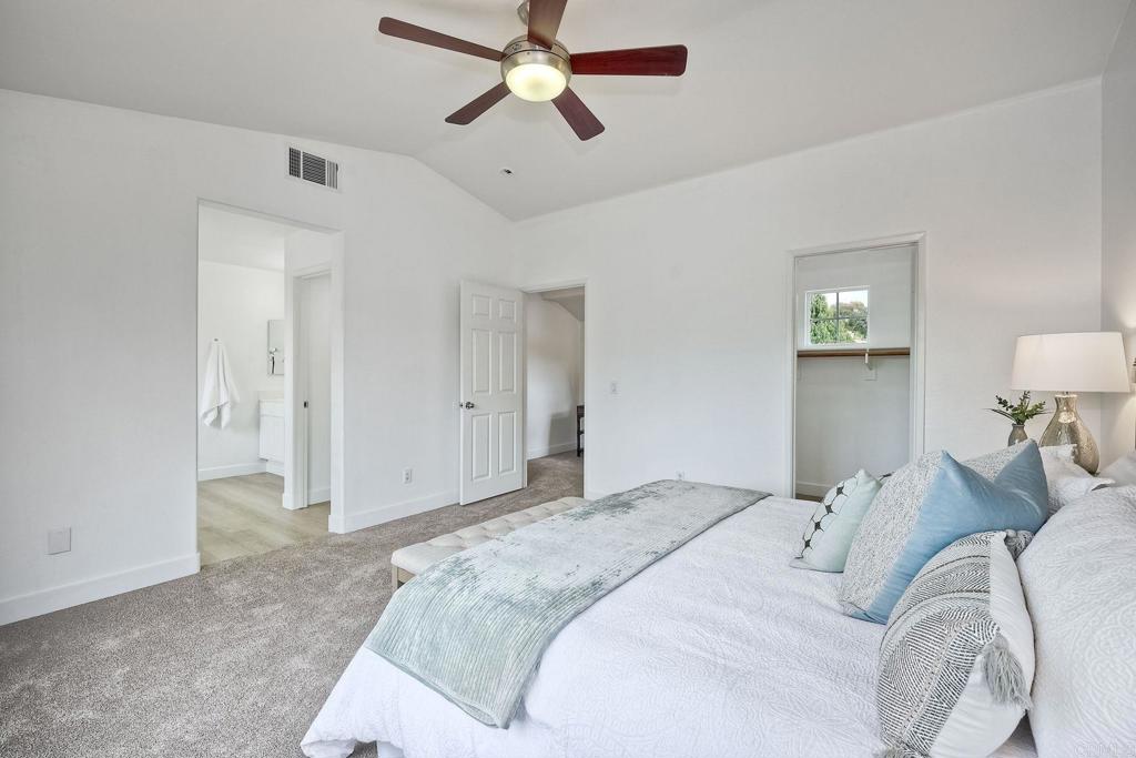 1120 Lassen Peak Place Chula Vista, CA 91913 - Photo 28 of 48 a bedroom with a bed and a chandelier