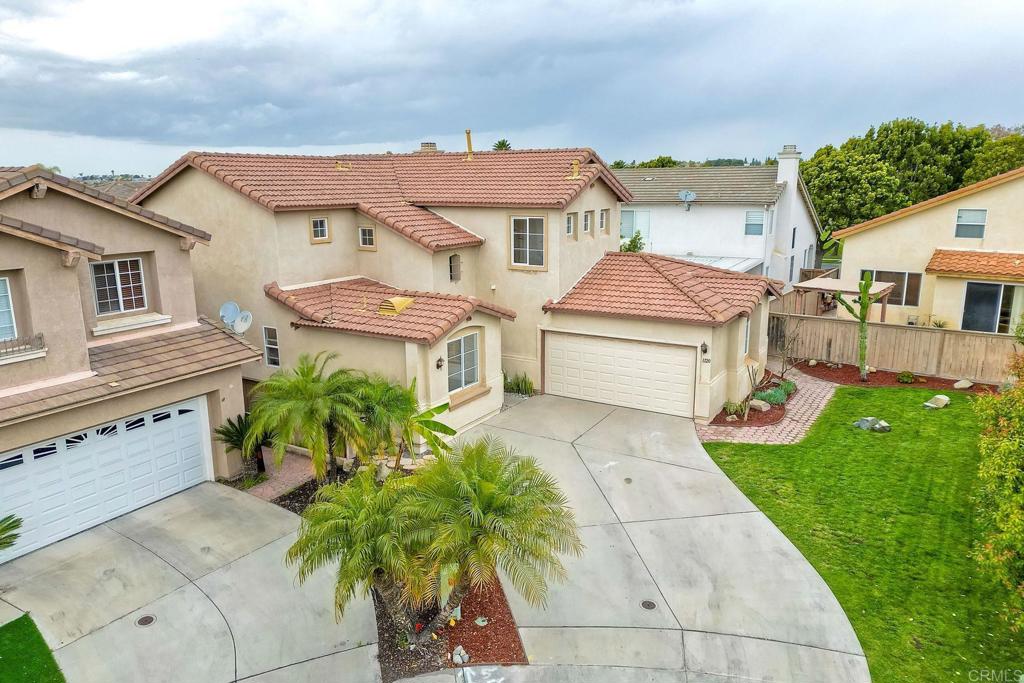 1120 Lassen Peak Place Chula Vista, CA 91913 - Photo 3 of 48 a aerial view of a house with a yard and plants