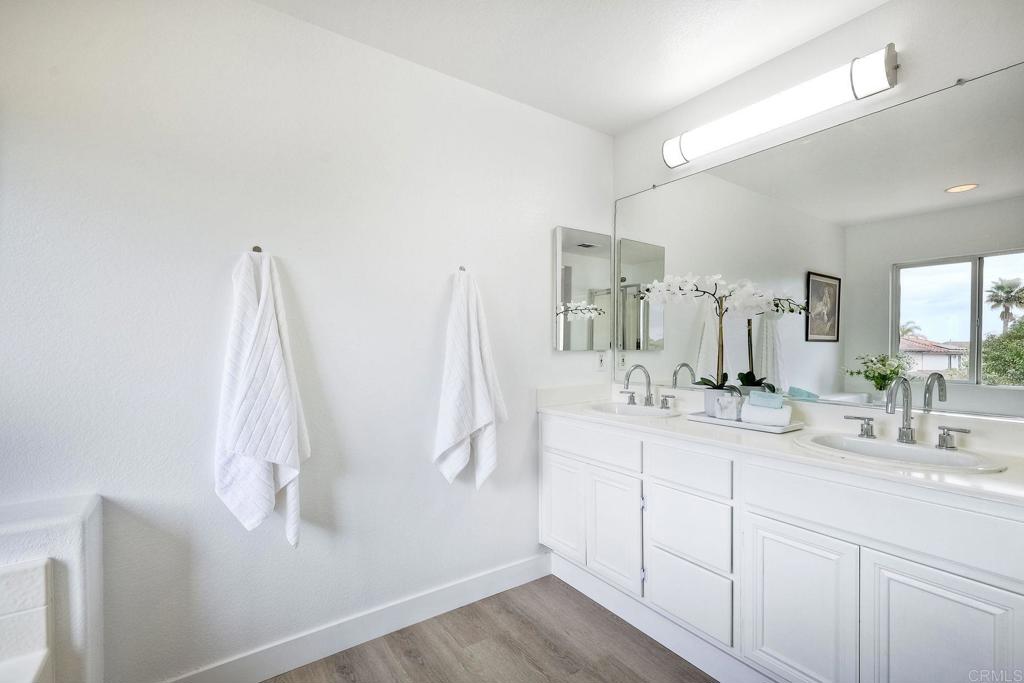 1120 Lassen Peak Place Chula Vista, CA 91913 - Photo 31 of 48 a bathroom with a double vanity sink and mirror