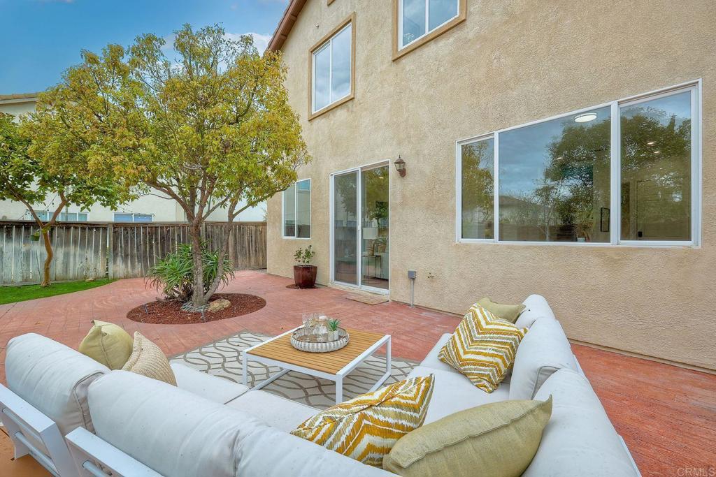 1120 Lassen Peak Place Chula Vista, CA 91913 - Photo 34 of 48 a view of a patio with couches table and chairs and potted plants