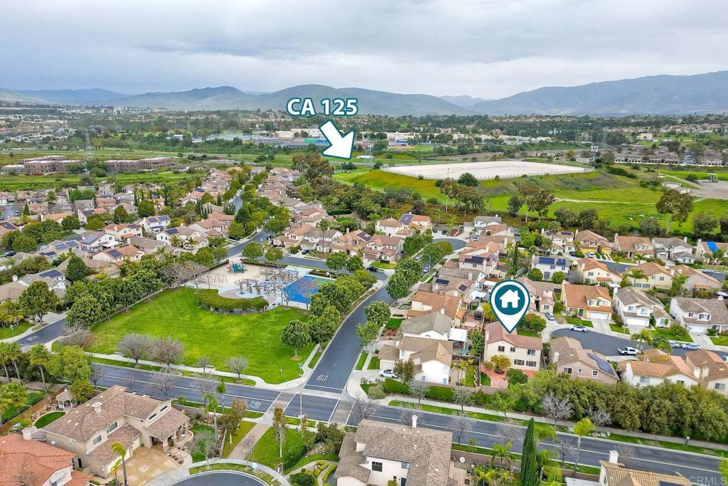 1120 Lassen Peak Place Chula Vista, CA 91913 - Photo 45 of 48 an aerial view of residential houses with outdoor space and swimming pool