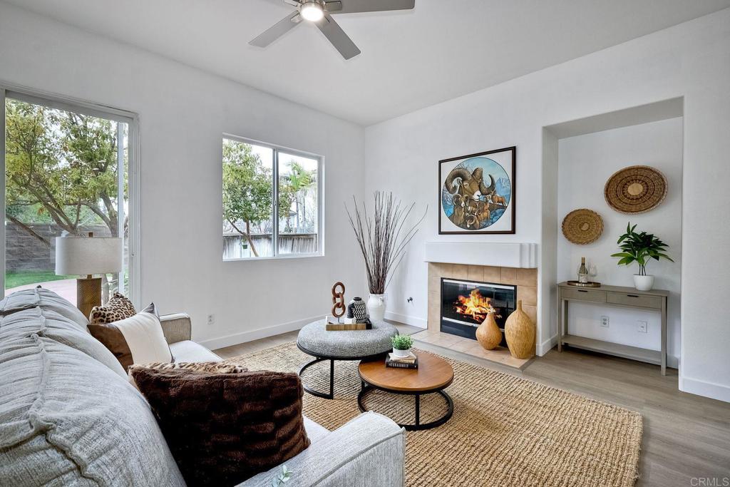 1120 Lassen Peak Place Chula Vista, CA 91913 - Photo 8 of 48 a living room with furniture and a fireplace