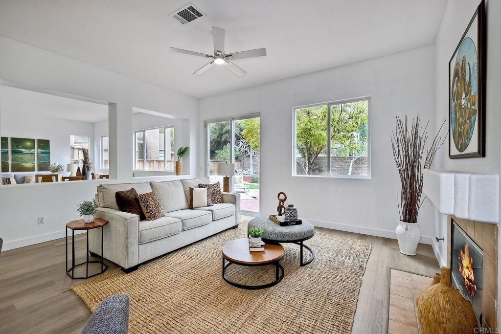 1120 Lassen Peak Place Chula Vista, CA 91913 - Photo 9 of 48 a living room with furniture and a fireplace