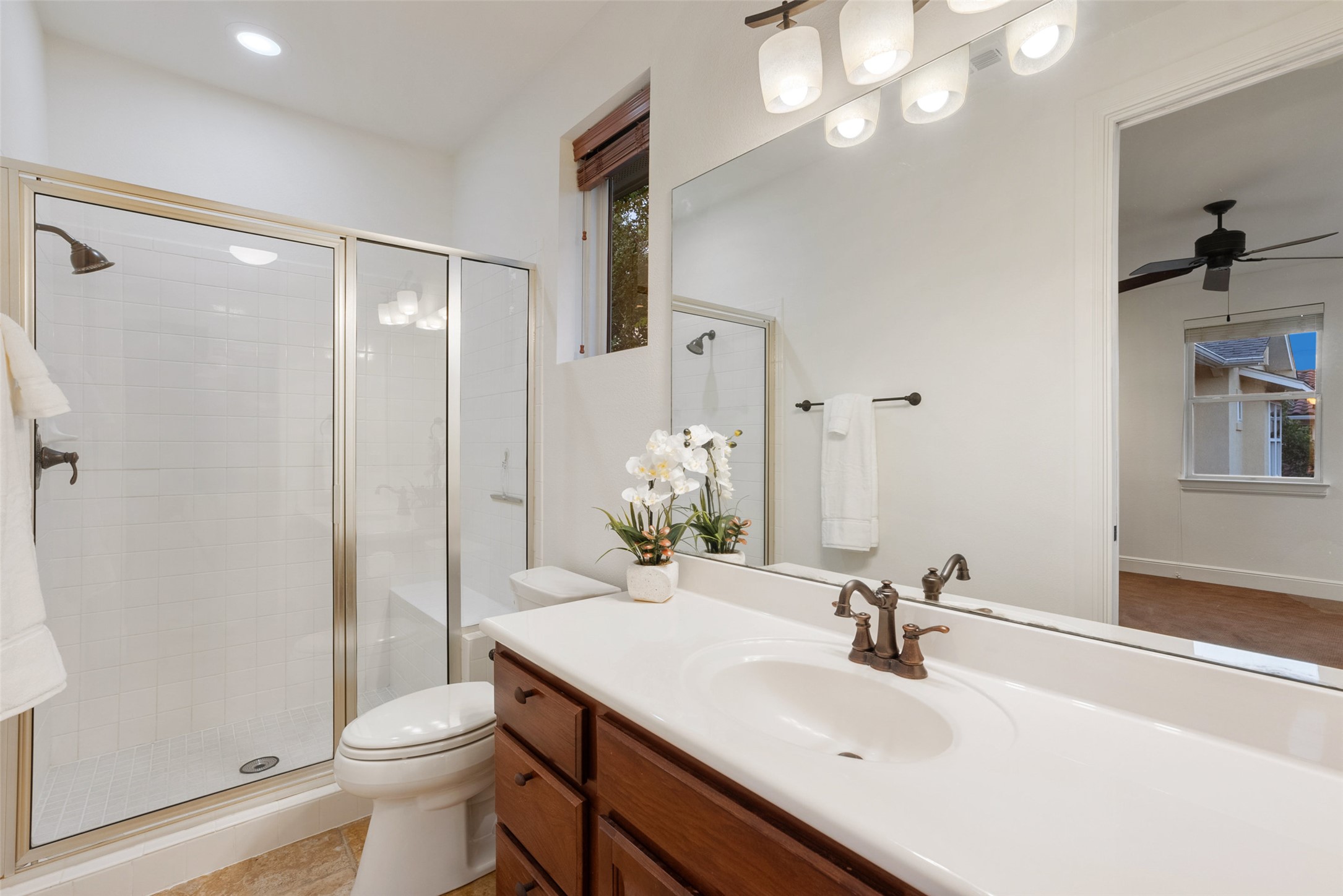 9308 Travertine Cove Austin, TX 78735 - Photo 23 of 40 a bathroom with a sink toilet and shower