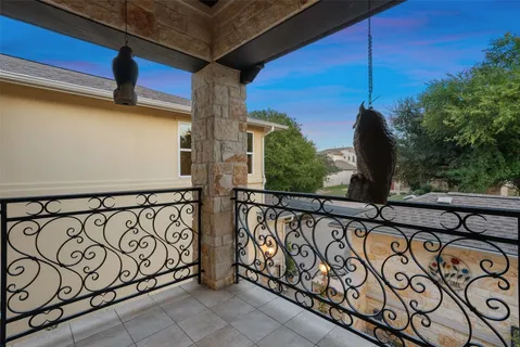 a room with pool table and windows