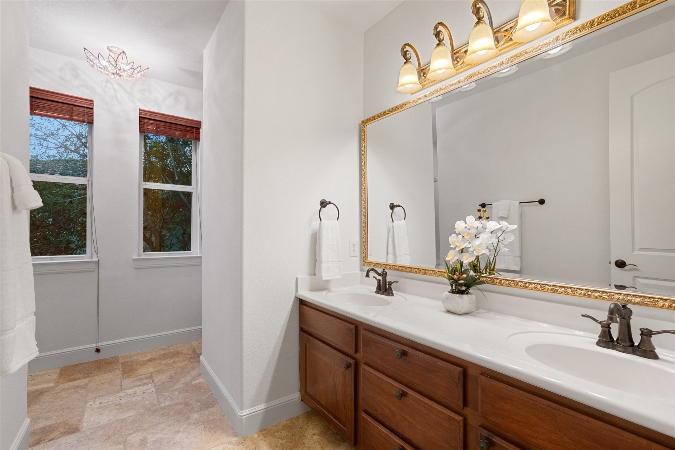 9308 Travertine Cove Austin, TX 78735 - Photo 26 of 40 a bathroom with a sink and a mirror