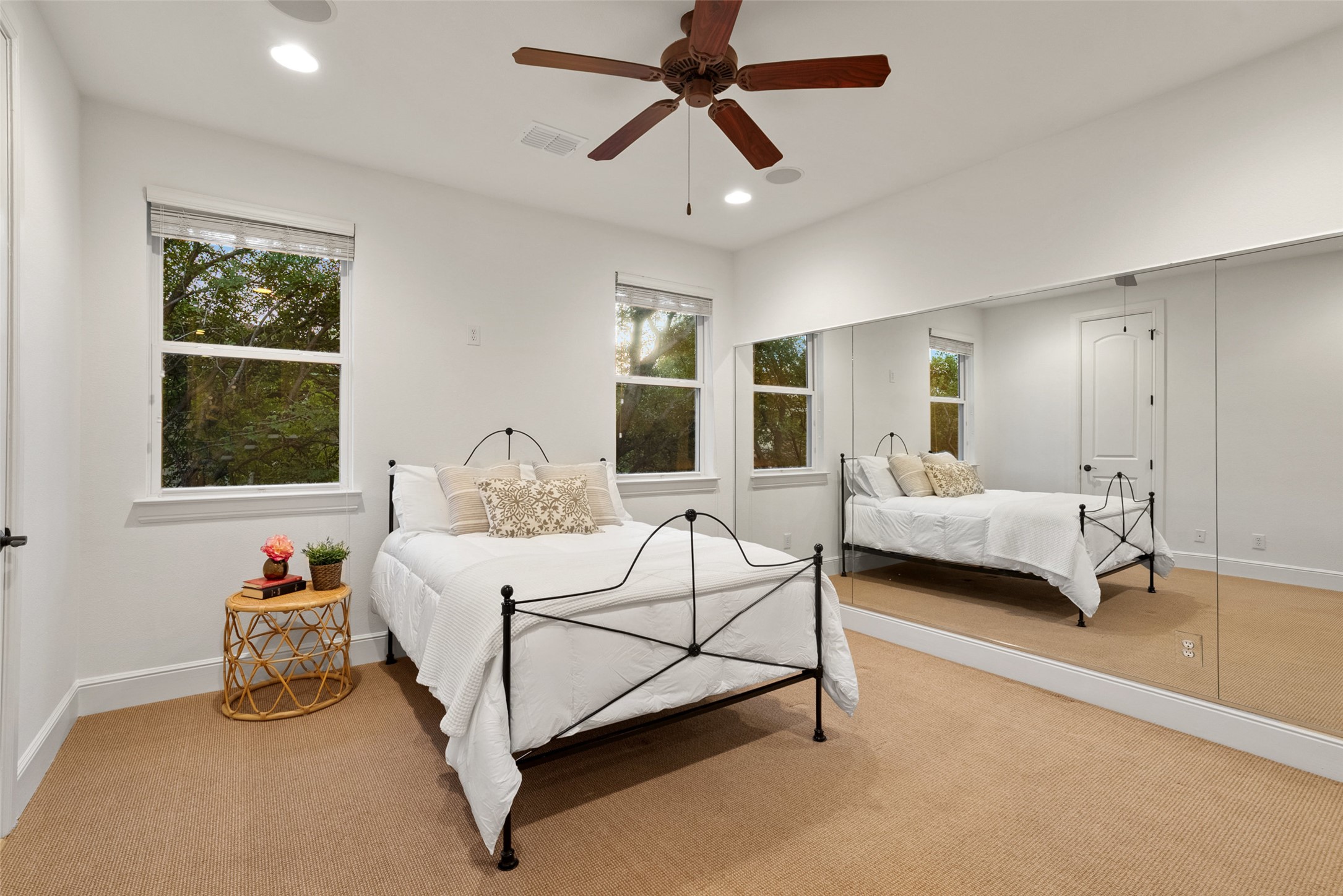 9308 Travertine Cove Austin, TX 78735 - Photo 27 of 40 a spacious bedroom with a bed and a window