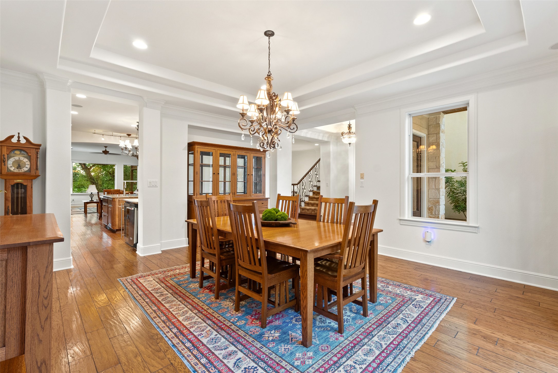 9308 Travertine Cove Austin, TX 78735 - Photo 7 of 40 a view of a dining room with furniture wooden floor and chandelier