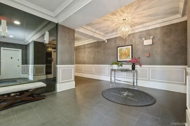 a lobby with furniture and a rug