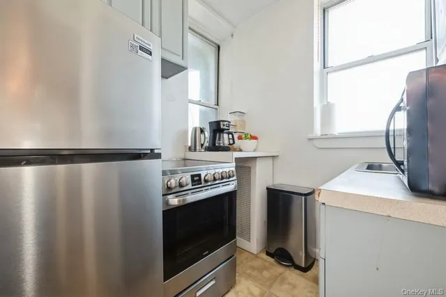 a kitchen with a stove and a refrigerator