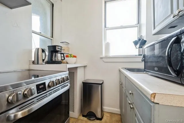 a kitchen with a stove and a sink